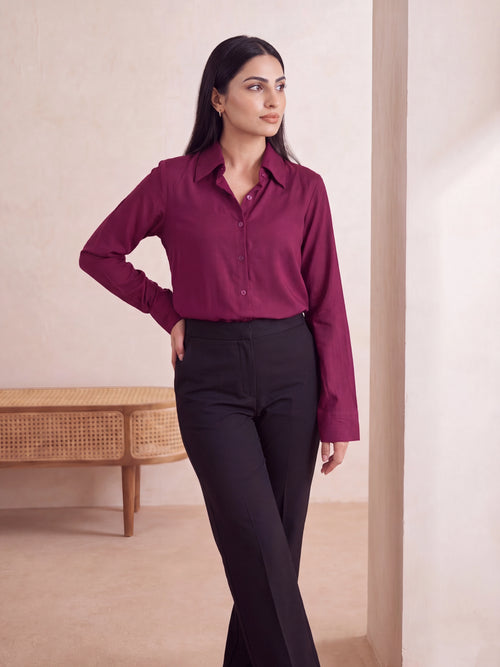 Side view of berry maroon rayon shirt showing relaxed boxy fit and curved shirttail hem
